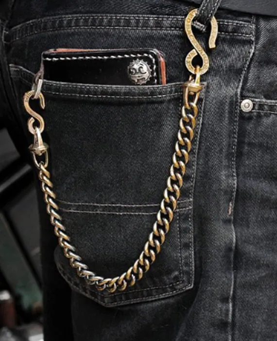 Gold single wallet chain on dark slim-fit jeans