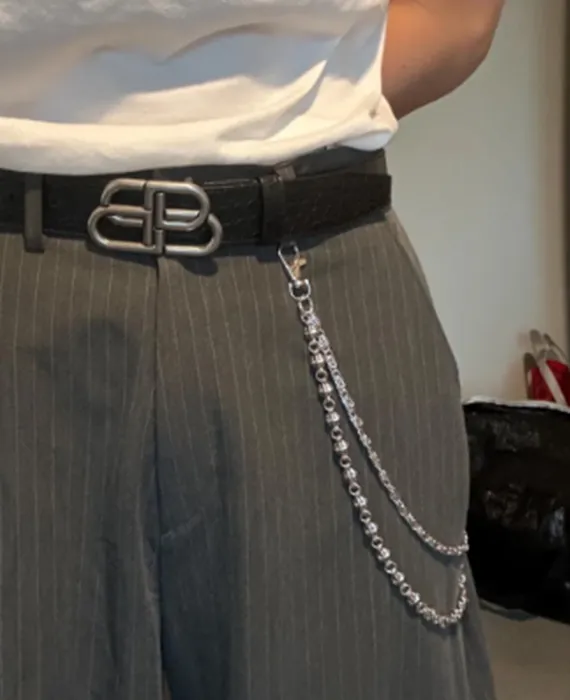 Silver double-pocket chain on gray dress pants