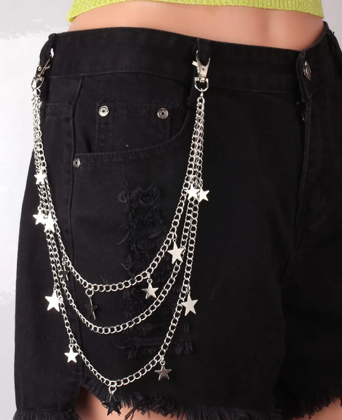 Minimalist star charm pant chain on black denim shorts